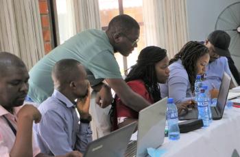 DR. Robert displaying genetic analysis to training participants